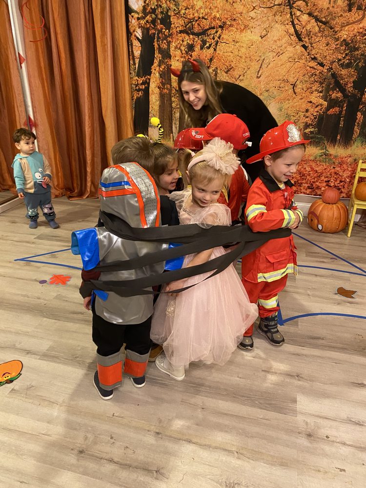 Children dressed as a firefighter and a princess during dramatic play