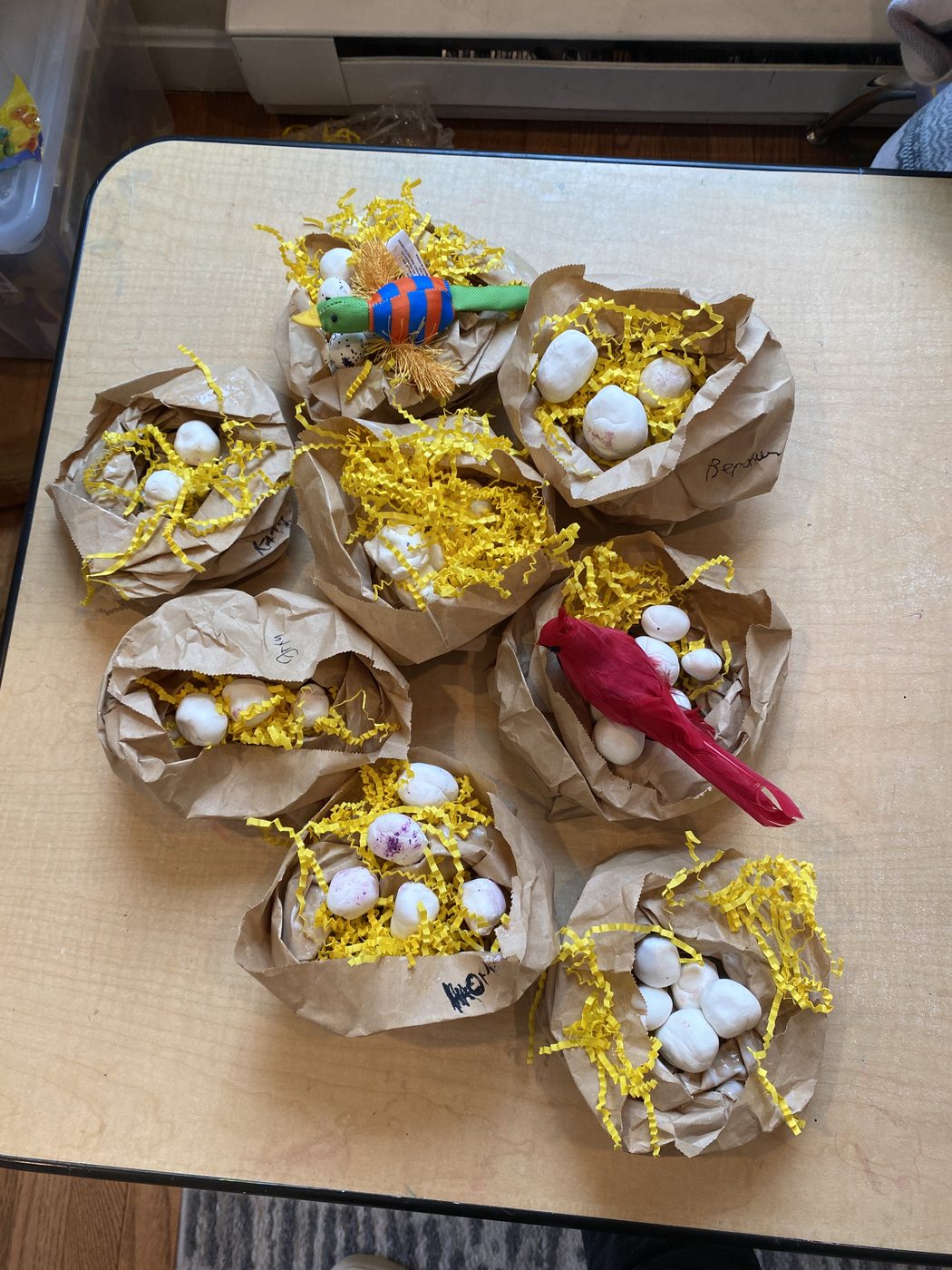 Handmade paper bag bird nests with eggs made during a science activity