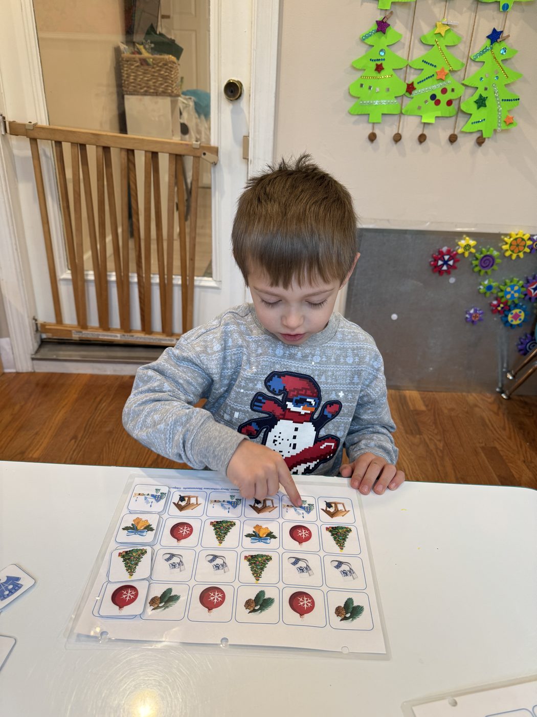 A child matching colorful pattern cards during a math activity