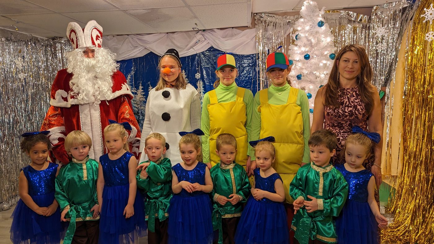 Children celebrating a New Year's holiday party at the daycare