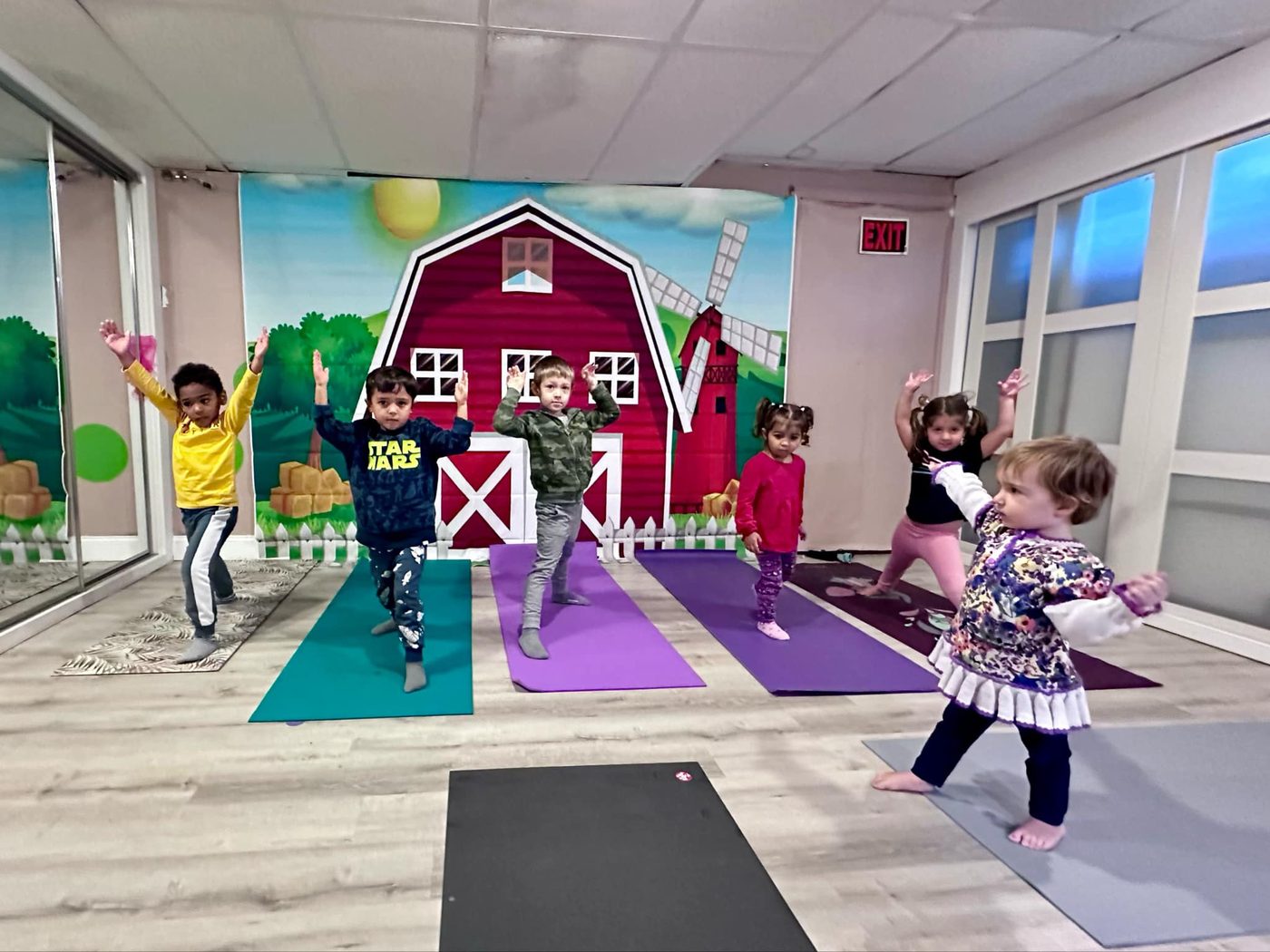 Children practicing yoga during an enrichment class